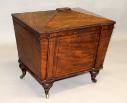A 19TH CENTURY MAHOGANY SARCOPHAGUS SHAPED CELLARETTE, the interior fitted for six bottles,