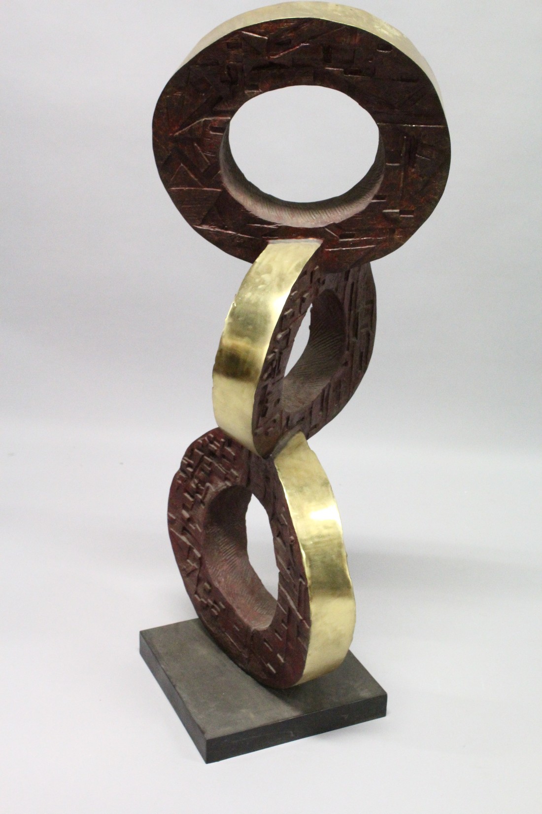 A LARGE BRONZE ABSTRACT MODEL, three rings on a square base. 4ft high. - Image 3 of 3