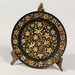 A SUPERB TOLEDO GILT DECORATED CIRCULAR DISH decorated with birds and foliage. 5.5ins diameter.
