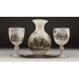 A RICHARDSONS FROSTED GLASS EWER AND A PAIR OF GOBLETS, with enamel decoration, Arab scenes (3).