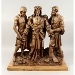 A SUPERB 18TH CENTURY GERMAN CARVED LIMEWOOD GROUP, CHRIST with two men, the base with a cross and