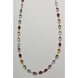 AN 18CT YELLOW GOLD MULTI COLOURED GEM SET NECKLACE