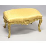 A GILT FRAMED WINDOW SEAT with yellow cover. 3ft wide
