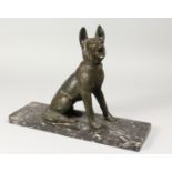 AN ART DECO CAST SPELTER MODEL OF A SEATED ALSATIAN DOG, on a rectangular marble base. 15ins long.