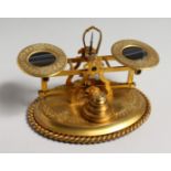 A GOOD SET OF ORMOLU SCALES AND WEIGHTS, the balances inset with tigers eye panels, with allover