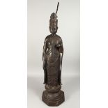 A LARGE CHINESE BRONZE GOD with a halo, on an octagonal base, 36ins high.