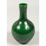 A CHINESE GREEN BULBOUS VASE, mark in blue. 6ins high.