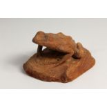 A WOODEN CARVING OF A FROG. 7ins long