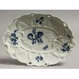 AN 18TH CENTURY WORCESER BASKET WEAVE MOULDED DISH, each handle with a large moulded leaf, painted