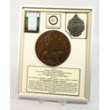 A FRAMED AND GLAZED WW1 BRONZE MEMORIAL DEATH PLAQUE or "Dead Man's Penny" S/11944. Private Gavin