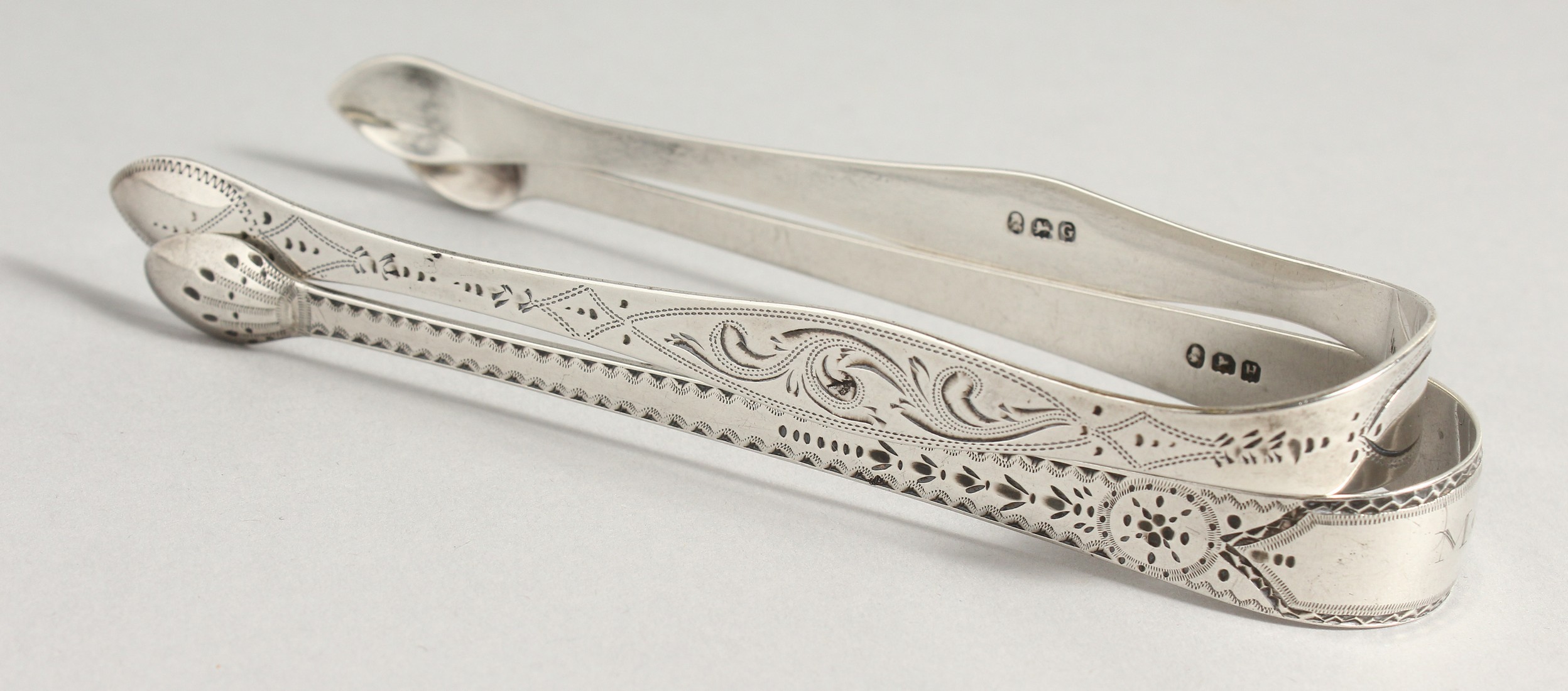 TWO GEORGE III BRIGHT CUT SUGAR TONGS. London 1802, maker Peter, Ann and William Bateman & London - Image 2 of 10