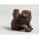 A CARVED WOOD FO DOG AND PUPPY