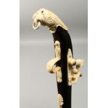 A BONE GUN WALKING STICK, 36ins long.