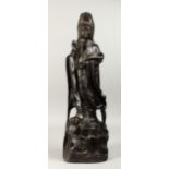 A LARGE CHINESE CARVED ROSEWOOD GUANYLIN FIGURE, 24ins high.