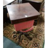 A 19TH CENTURY ROSEWOOD PEDESTAL SEWING TABLE, possibly Isle of Man, on curving pad feet.