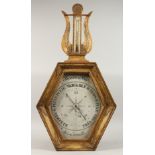 AN 18TH CENTURY TORICELLI TYPE BAROMETER, in a gilt wood frame, the octagonal dial 16ins x 12ins,