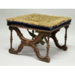 A VICTORIAN WALNUT SQUARE TOP STOOL with needlework top. 20ins.