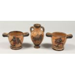 A PAIR OF OLD TWO HANDLED POTTERY POTS with Egyptian scenes. 3.5ins high and a TWO HANDLED VASE 6ins