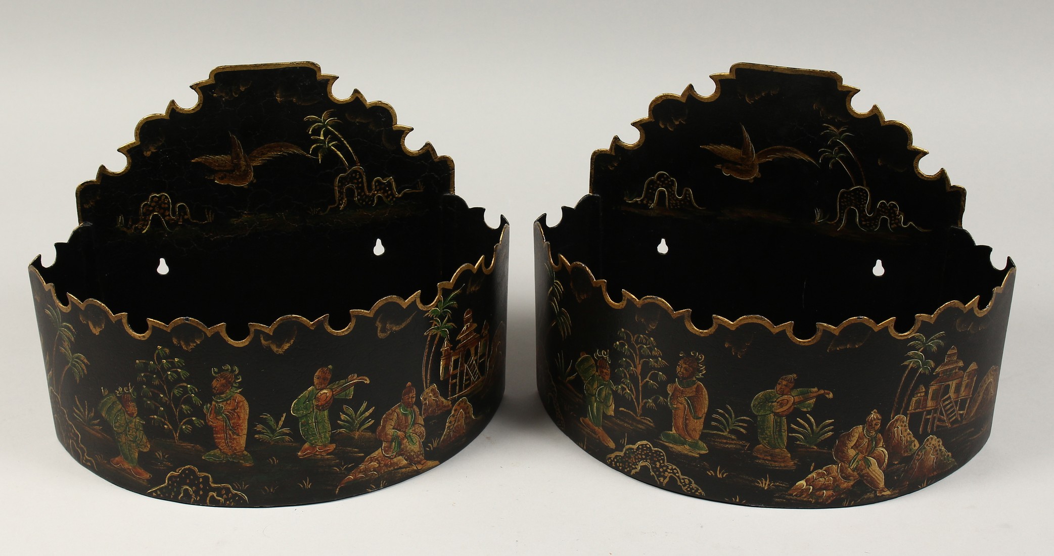 A PAIR OF HALF MOON TOLLWARE WALLPOCKETS, Chinese design, 11ins diameter.