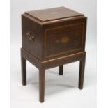 A REGENCY MAHOGANY CELLARETTE ON A STAND with rising top and fitted interior for twelve bottless.