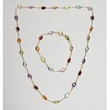 AN 18CT YELLOW GOLD 18 CT. MULTI GEM SET NECKLACE AND CHAIN.