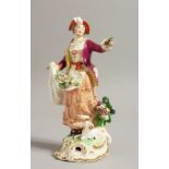 AN 18TH CENTURY DERBY FIGURE OF A SHEPERDESS with a sheep dog at her feet.