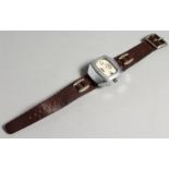 A MAN'S 1950'S WRIST WATCH with leather strap.
