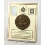 A FRAMED AND GLAZED WW1 BRONZE MEMORIAL DEATH PLAQUE or "Dead Man's Penny" 385043. Rifleman