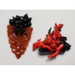 TWO DESIGNER FAUX CORAL BROOCHES