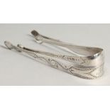 TWO GEORGE III BRIGHT CUT SUGAR TONGS, London 1799, Peter and Rene Babiion and maker I.C.