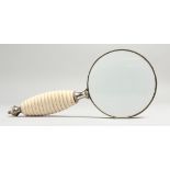 A GOOD MAGNIFYING GLASS with ivory handle.