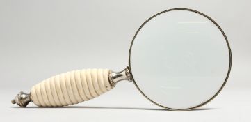 A GOOD MAGNIFYING GLASS with ivory handle.