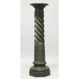 A FINE GREEN MARBLE, SERPENTINE FLUTED COLUMN with revolving top.