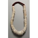 A TRIBAL SHELL NECKLACE