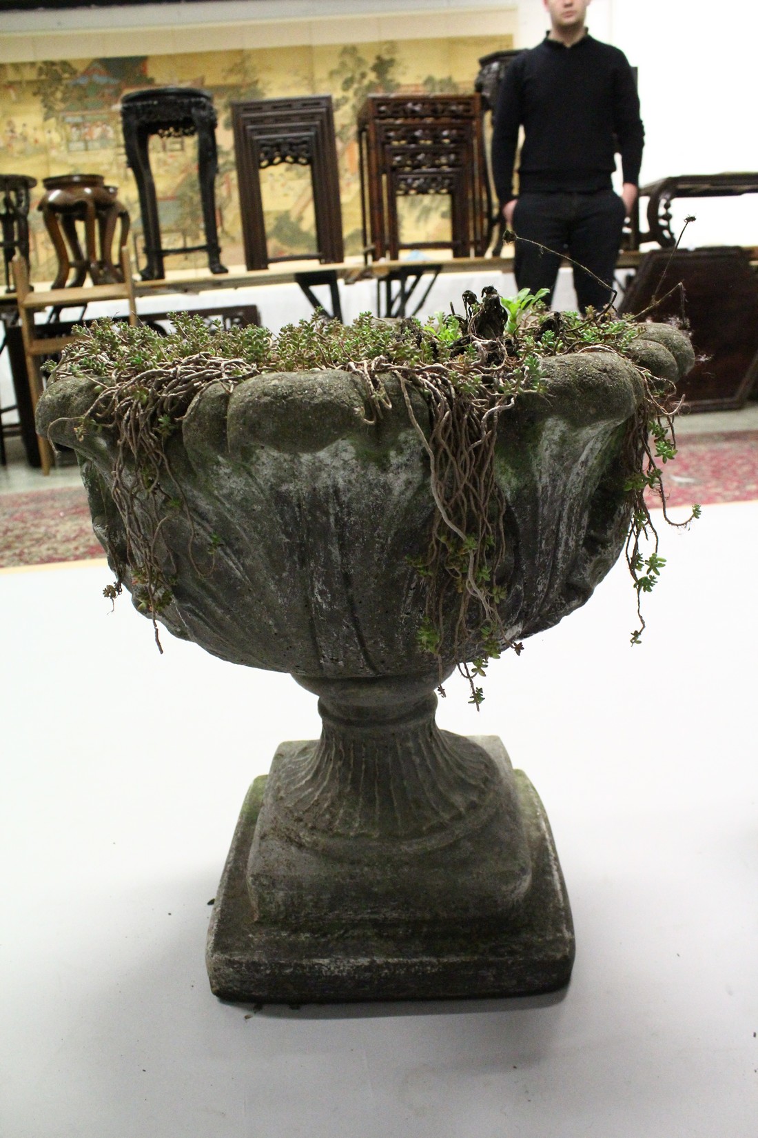 A PAIR OF WEATHERED COMPOSITE GARDEN URNS on pedestal bases. 21ins high x 19 ins diameter. - Image 6 of 6