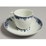 AN 18TH CENTRUY WORCESTER COFFEE CUP, TEABOWL AND SAUCER painted in blue with a large flower and