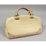 MADLER, A SALTWATER CROCODILE BAG, 14ins, with export documents.