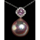 A LARGE 16mm PINK PEARL PENDANT, PINK SAPPHIRE AND DIAMOND TOP