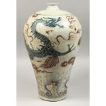 A CHINESE PORCELAIN BLUE AND WHITE DRAGON VASE 18ins high.