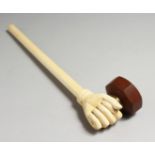 A GOOD 19TH CENTURY CHINESE CARVED AND TURNED IVORY OPIUM PIPE, carved as a hand with bronze