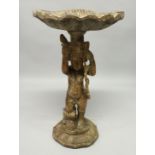A LARGE CARVED WOOD SHELL AND CUPID STAND, 3ft 6ins long.