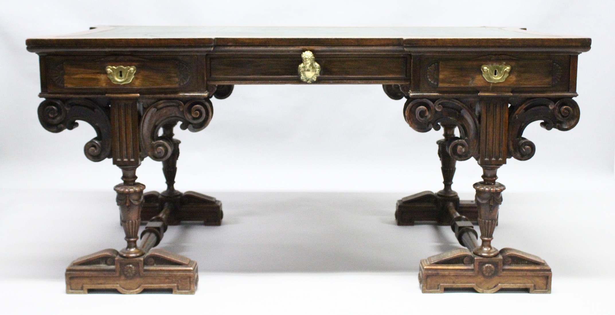 A VICTORIAN WALNUT DESK by MORANT, BOYD & BLANDFORD, 91 NEW BOND ST., the rectangular top of