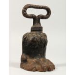 A GEORGIAN CAST IRON PAW DOOR STOP. 7ins.