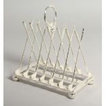 A SILVER PLATED NOVELTY CROSSED GOLF CLUBS TOAST RACK.