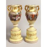 A VERY GOOD PAIR OF 19TH CENTURY YELLOW GROUP VIENNA TWO HANDLED URNS AND STANDS, with snake handles