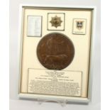 A FRAMED AND GLAZED WW1 BRONZE MEMORIAL DEATH PLAQUE or "Dead Man's Penny" 16985. Private George