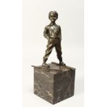 AFTER FERDINAND PRIESS (1882 - 1943) GERMAN A BRONZE FIGURE OF A YOUNG BOY ON SKIS, his hands in his