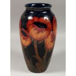 A LARGE MOORCROFT POPPY DESIGN VASE, script signature, 13ins high