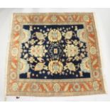 A GOOD PERSIAN CARPET, blue ground with stylised decoration, within an orange border. 7ft 6ins x 7ft