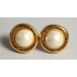 A PAIR OF GILT AND PEARL EAR CLIPS.